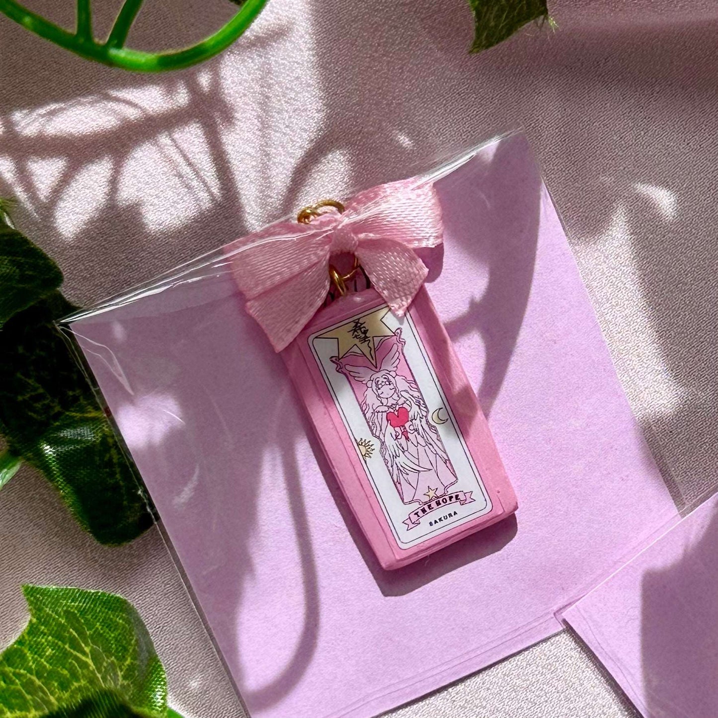 Porte-clé Sakura Cardcaptor carte The Hope avec nœud rose
